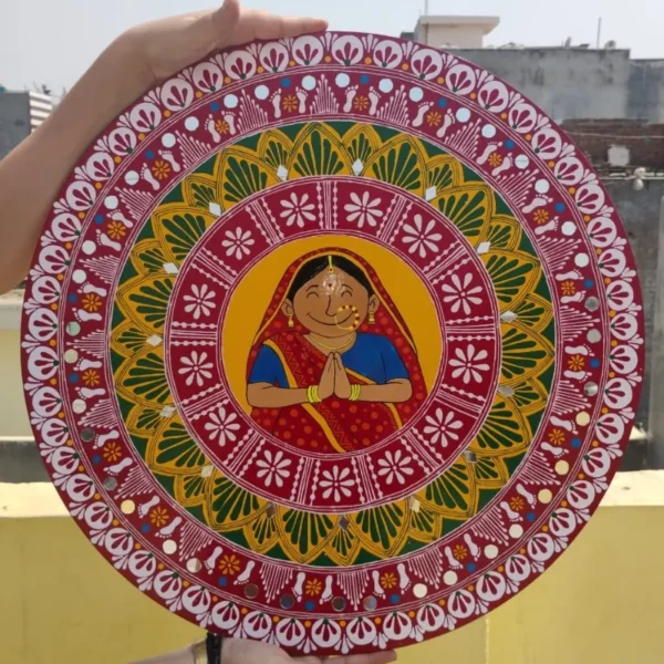 Add a touch of tradition to your home with this hand-painted Aipan Wall Plate made on premium MDF board. Featuring a vibrant “Namaste” lady design and intricate Uttarakhand Aipan patterns, this lightweight and durable décor piece is perfect for entrances, living rooms, pooja rooms, and gifting.